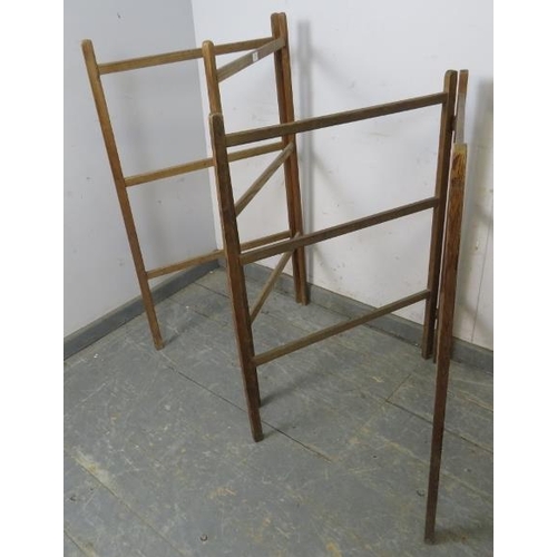 825 - A matched pair of antique pine folding towel rails. 
H107cm W61cm D4cm (approx).
Condition report: S... 