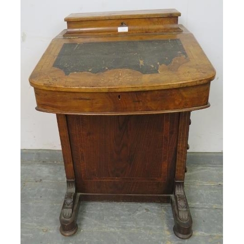 828 - A Victorian walnut Davenport for restoration, having marquetry and crossbanded burr walnut inlay, on... 