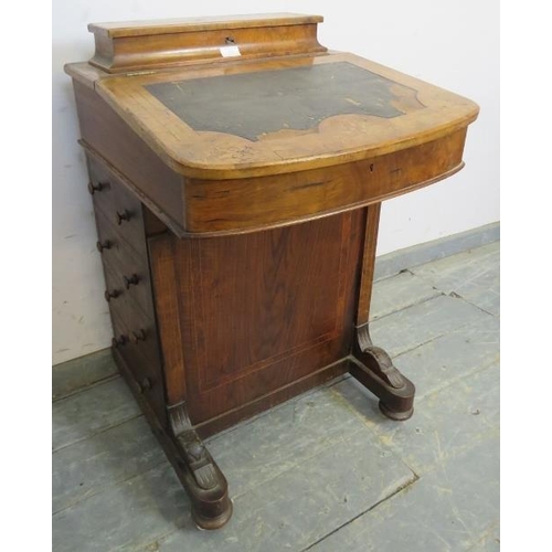 828 - A Victorian walnut Davenport for restoration, having marquetry and crossbanded burr walnut inlay, on... 