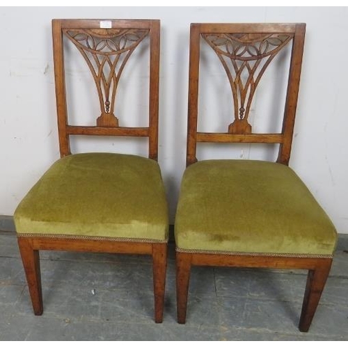 831 - A pair of Georgian fruitwood side chairs, the pierced backs with batwing inlay, on tapered square su... 