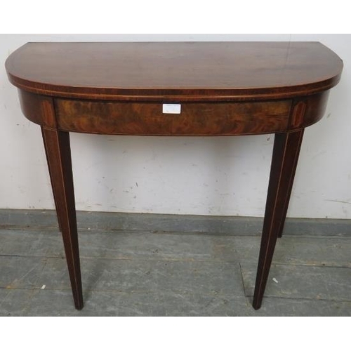 834 - A Georgian mahogany turnover tea table, crossbanded and strung with boxwood, satinwood and ebony, on... 