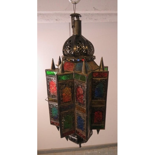 837 - A vintage Moroccan hanging lantern, having multicoloured glass panels with etched decoration. 
H65cm... 