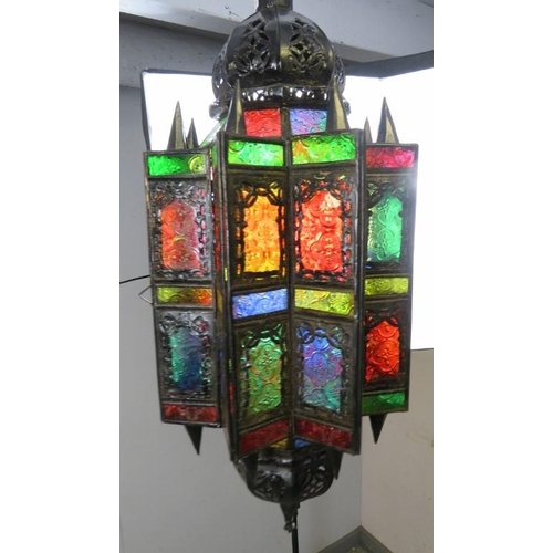 837 - A vintage Moroccan hanging lantern, having multicoloured glass panels with etched decoration. 
H65cm... 