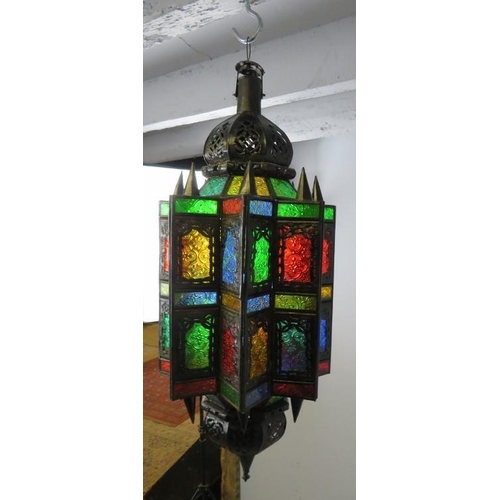 837 - A vintage Moroccan hanging lantern, having multicoloured glass panels with etched decoration. 
H65cm... 