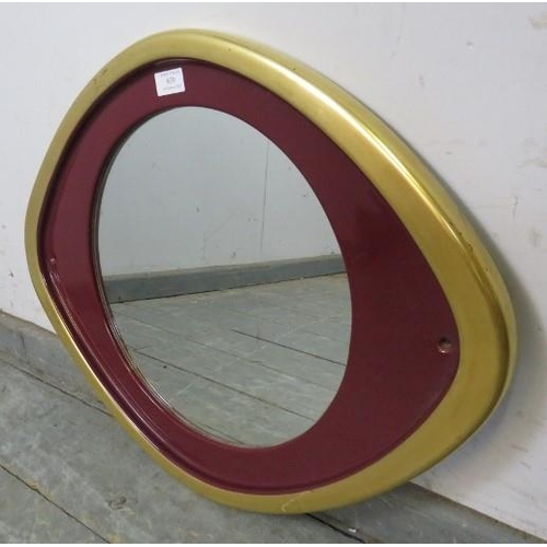 839 - A circular bathroom wall mirror, within an elliptical ceramic parcel gilt and claret surround.
H49cm... 