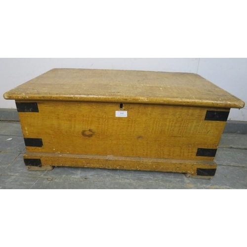 845 - An antique pine flat topped trunk/blanket box, having metal strapwork mounts and carry handles to ei... 