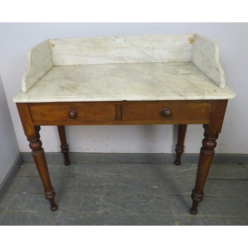 846 - A Victorian mahogany washstand, the white marble top with ¾ gallery, housing two short drawers with ... 