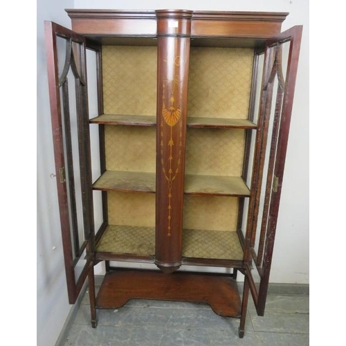 847 - An Edwardian mahogany glazed display cabinet strung with satinwood, having bow-fronted marquetry inl... 