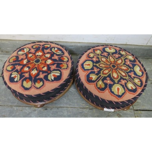 848 - A pair of 19th century walnut footstools recovered with brightly coloured Middle Eastern tapestry ma... 