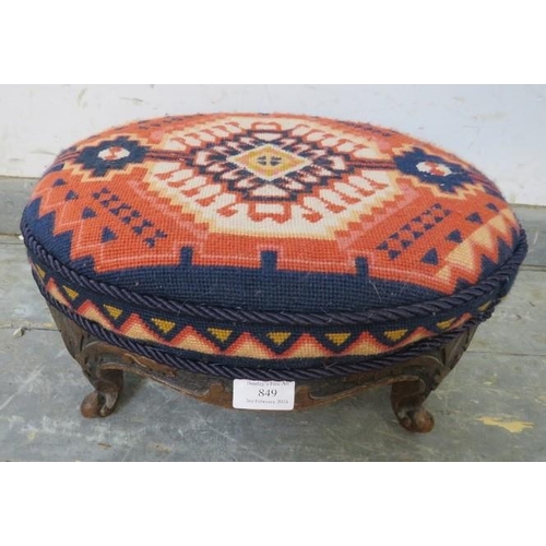 849 - A 19th century oval walnut footstool, recovered with brightly coloured Middle Eastern tapestry mater... 