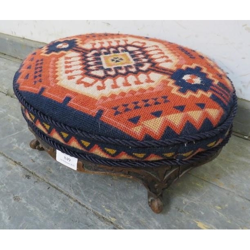 849 - A 19th century oval walnut footstool, recovered with brightly coloured Middle Eastern tapestry mater... 