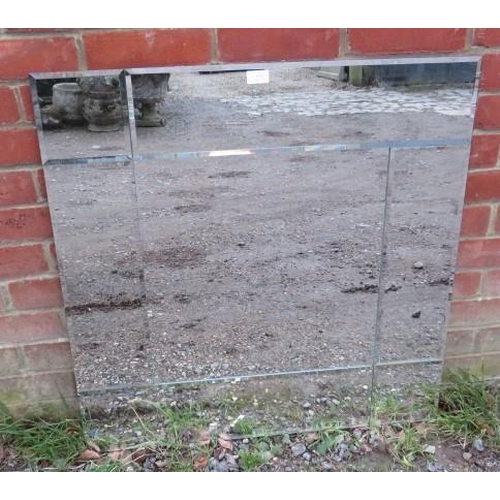 852 - A large contemporary square wall mirror with sectioned and bevelled plates. 
H80cm W80cm (approx).
C... 