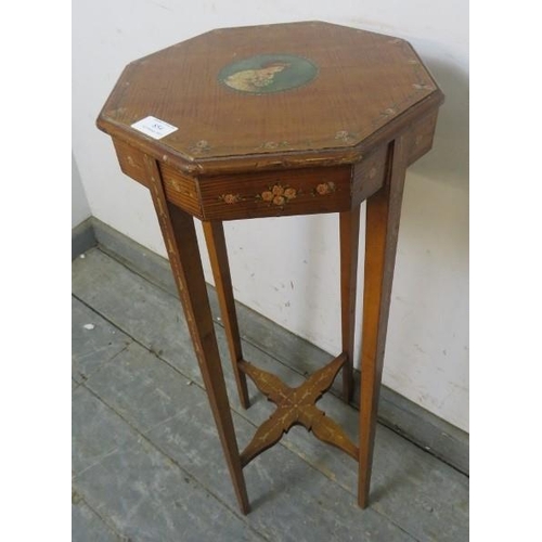 854 - A turn of the century walnut octagonal occasional table, hand-painted with central panel depicting a... 