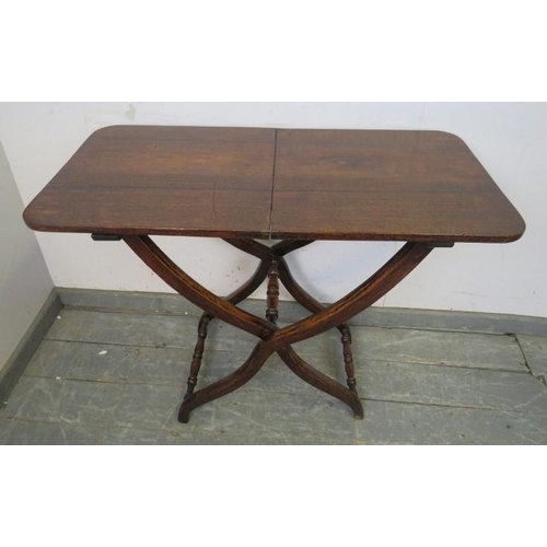 855 - A 19th century mahogany folding coaching table, on curved supports with turned stretchers. 
H73cm W9... 