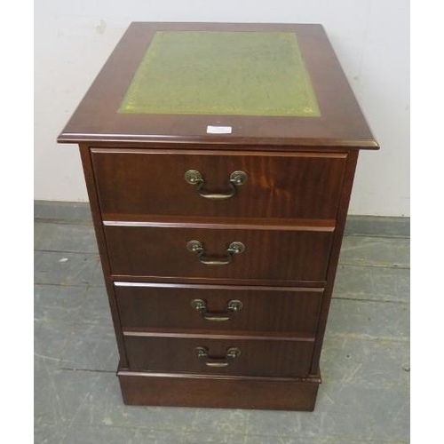 858 - A reproduction mahogany filing cabinet, the top with inset green leather, housing two deep drawers w... 