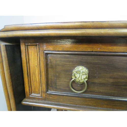 859 - A vintage mahogany sofa table in the Regency taste, having short cock-beaded drawers with gilt brass... 