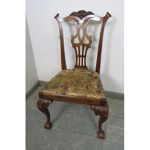 862 - An antique mahogany occasional chair in the Chippendale taste, having well carved shell cornice and ... 