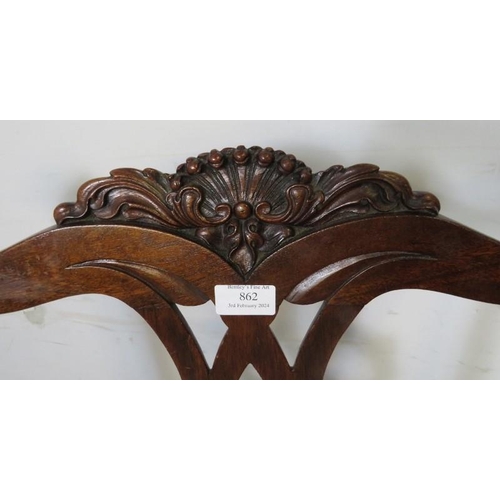 862 - An antique mahogany occasional chair in the Chippendale taste, having well carved shell cornice and ... 