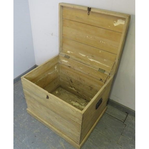 864 - A large antique stripped pine corn box/flat topped trunk with hasp and stable catch and carry handle... 