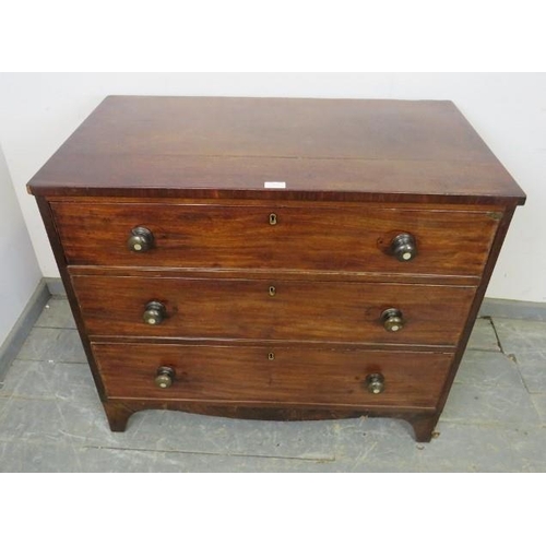 867 - A Georgian mahogany straight front chest of small proportions, housing three graduated cock-beaded d... 