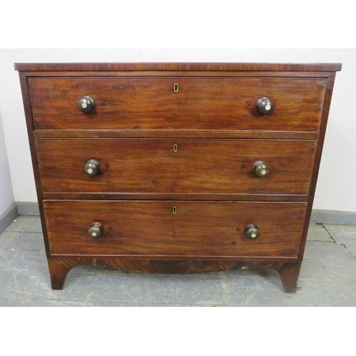 867 - A Georgian mahogany straight front chest of small proportions, housing three graduated cock-beaded d... 