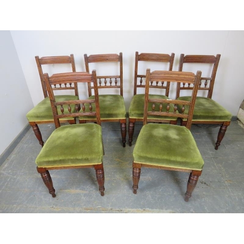 868 - A set of six turn of the century mahogany dining chairs, the reeded backs with fluted spindles, upho... 