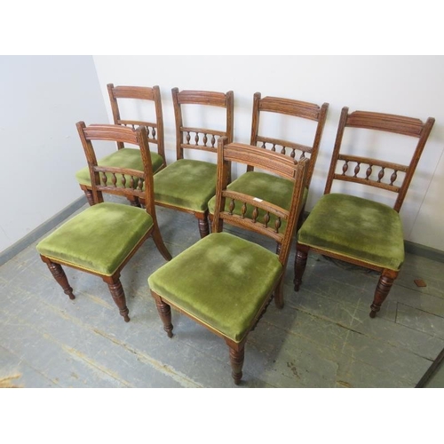 868 - A set of six turn of the century mahogany dining chairs, the reeded backs with fluted spindles, upho... 