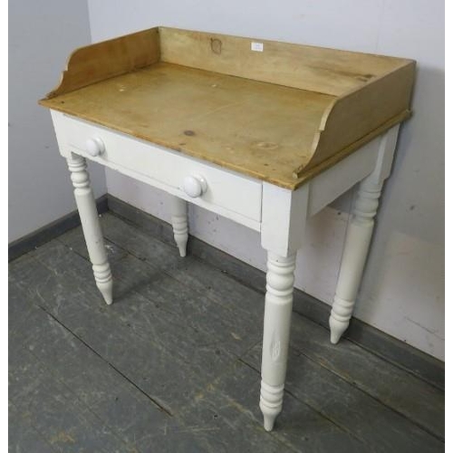 869 - An antique pine washstand, having ¾ gallery, the single frieze drawer fitted with ceramic knob handl... 