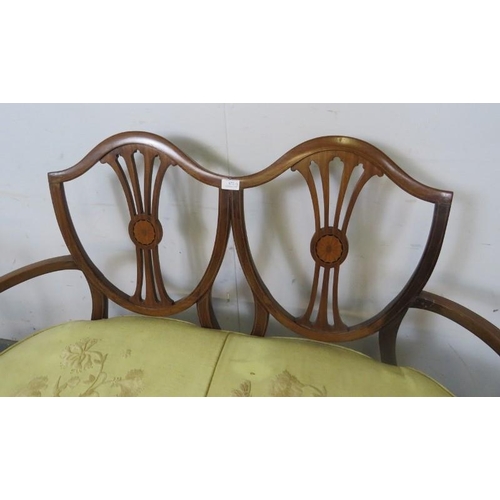 872 - An Edwardian mahogany three-piece suite comprising an open sided sofa and two chairs, the pierced sh... 