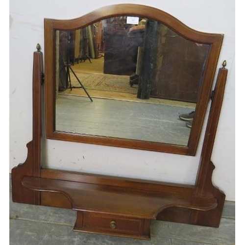 887 - An Edwardian mahogany swing vanity mirror strung with boxwood, the uprights with brass acorn finials... 