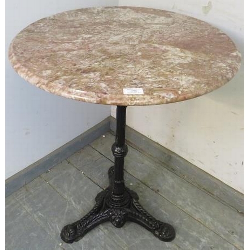 896 - An antique style outdoor pedestal table, the circular rouge marble top on a tapered reeded cast iron... 