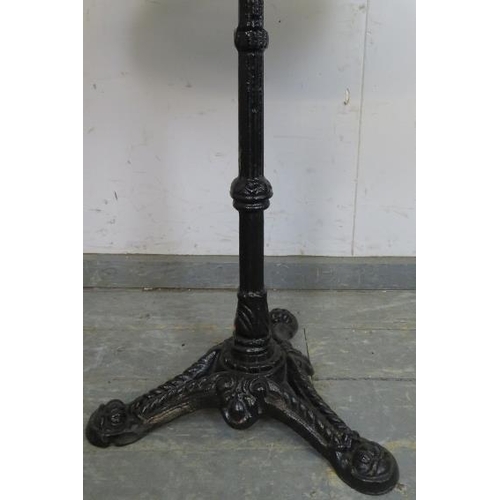 896 - An antique style outdoor pedestal table, the circular rouge marble top on a tapered reeded cast iron... 