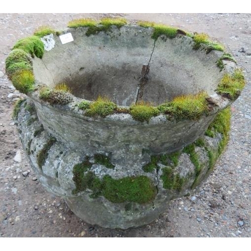 899 - A nicely weathered reconstituted stone garden urn in the Classical taste, with fluted decoration. 
H... 