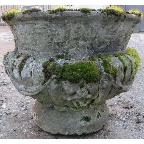 899 - A nicely weathered reconstituted stone garden urn in the Classical taste, with fluted decoration. 
H... 