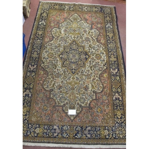 926 - A central Persian Isfahan carpet central floral motif cream, red, blue, with wide borders. In good c... 