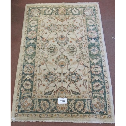 928 - A late 20th century wool rug. Flower design, green on cream ground, nice rug. Good clean condition. ... 