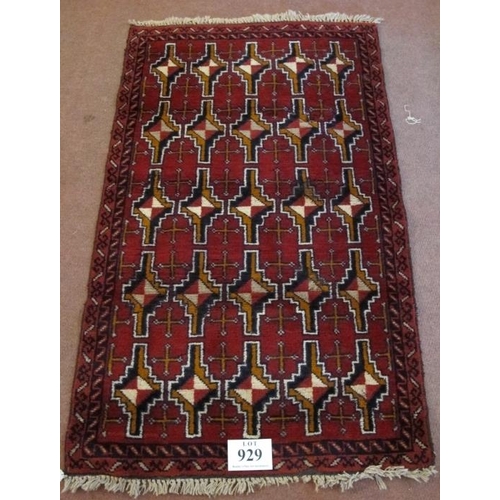 929 - Mid-late 20th century Persian rug central repeat motif block pattern on a deep red ground. 150cm x 8... 