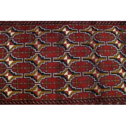 929 - Mid-late 20th century Persian rug central repeat motif block pattern on a deep red ground. 150cm x 8... 