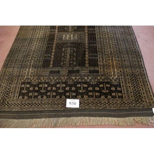 930 - A 20th century Turkoman rug. Central pattern on brown ground and intricate repeat border. 186cm x 13... 