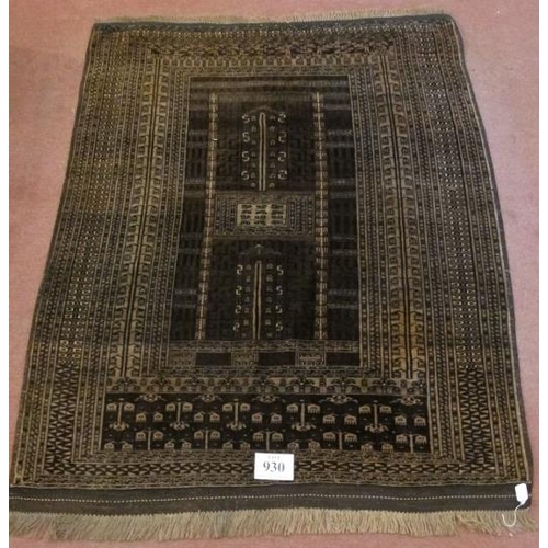 930 - A 20th century Turkoman rug. Central pattern on brown ground and intricate repeat border. 186cm x 13... 