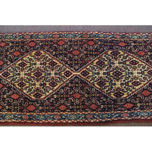 931 - North West Persian Senneh runner. 5 linked central motif on a dark blue ground. 240cm x 55cm (approx... 