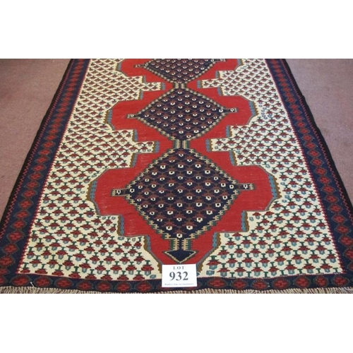 932 - A North West Persian Senneh Kilim rug. Three central linked diamond pattern on a red ground. Good co... 