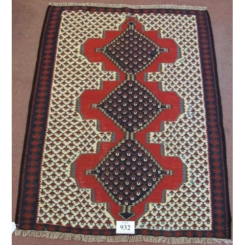 932 - A North West Persian Senneh Kilim rug. Three central linked diamond pattern on a red ground. Good co... 