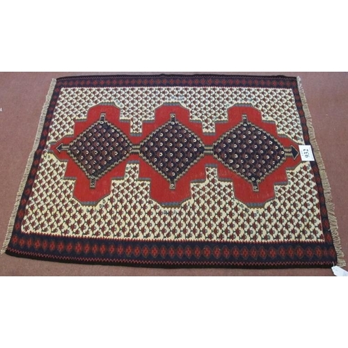 932 - A North West Persian Senneh Kilim rug. Three central linked diamond pattern on a red ground. Good co... 