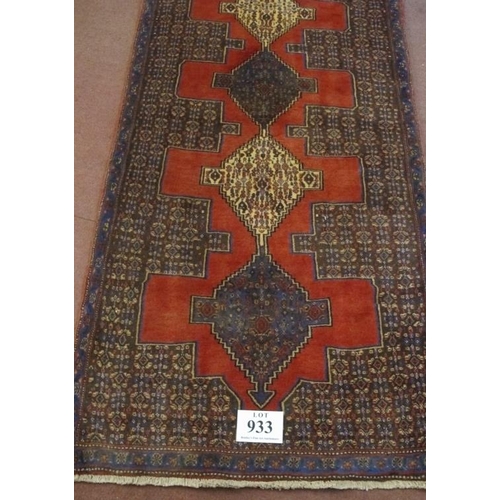 933 - A North West Persian Senneh runner. Central 9 linked diamond motif on claret ground. 330cm x 90cm (a... 