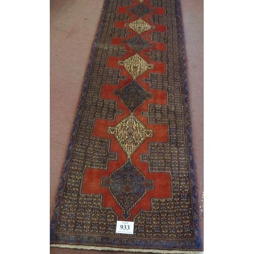 933 - A North West Persian Senneh runner. Central 9 linked diamond motif on claret ground. 330cm x 90cm (a... 