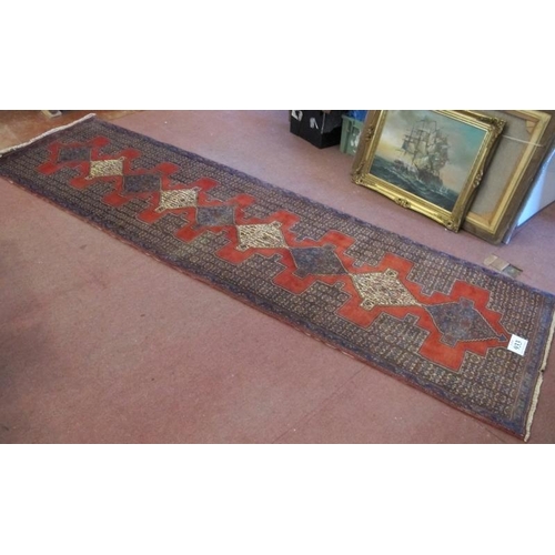 933 - A North West Persian Senneh runner. Central 9 linked diamond motif on claret ground. 330cm x 90cm (a... 