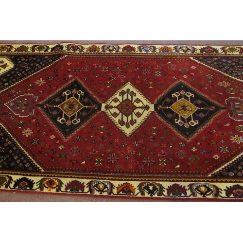 935 - South West Persian Qashqai runner. Central 3 linked diamond motif cream/blue on red ground. 280cm x ... 