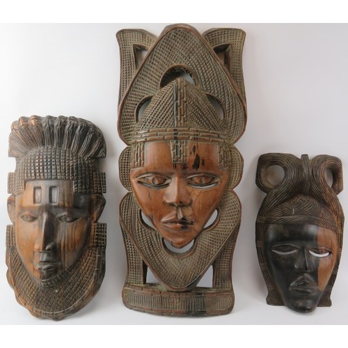 216 - Tribal Art: Three African carved hardwood ornamental masks, mid/late 20th century. (3 items) 61.5 cm... 