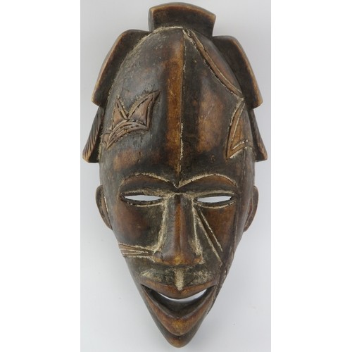 217 - Tribal Art: An African carved wood mask, probably Ivory Coast. 42 cm height. 
Condition report: Some... 